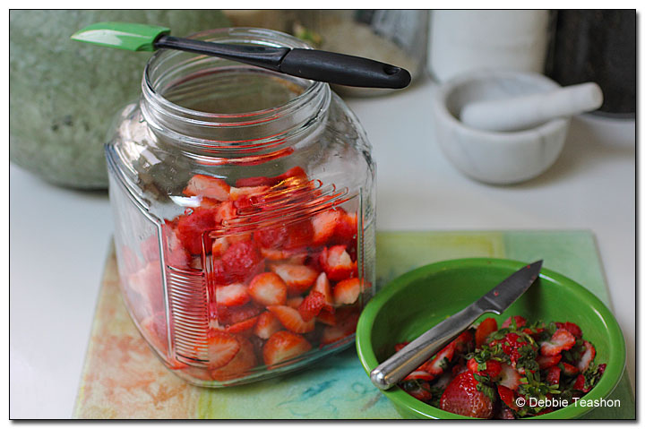 Washed, stemmed, and quartered strawberries