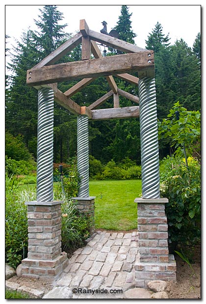 Arbor made from brick, steel and wood
